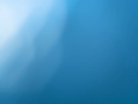 abstract blue background - macro shooting of light reflection on glass surface of flat bottle with waterの写真素材