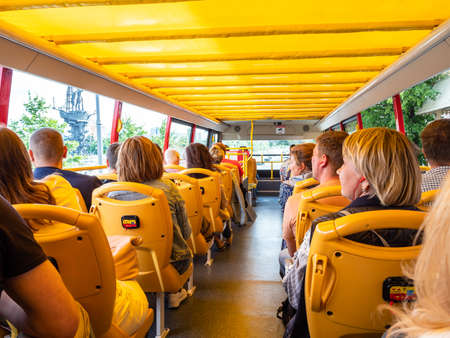 MOSCOW, RUSSIA - JULY 25, 2020: tourists look at city landmarks during city sightseeing tour on excursion bus in Moscow city on sunny summer dayのeditorial素材