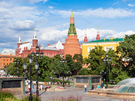 MOSCOW, RUSSIA - JULY 25, 2020: view of people on Manezhnaya square near green Alexander Garden of...