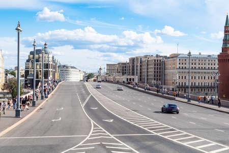 MOSCOW, RUSSIA - JULY 25, 2020: view of Bolshoy Moskvoretsky bridge over Moskva river with walking people and cars during city sightseeing tour on excursion bus in Moscow city on summer dayのeditorial素材