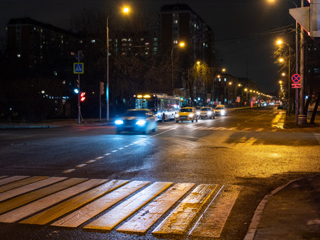 view of Zoya and Alexander Kosmodemyansky street in Moscow city in autumn night