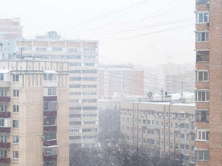 above view of snowfall in city on overcast winter day in Moscow, Russiaの写真素材