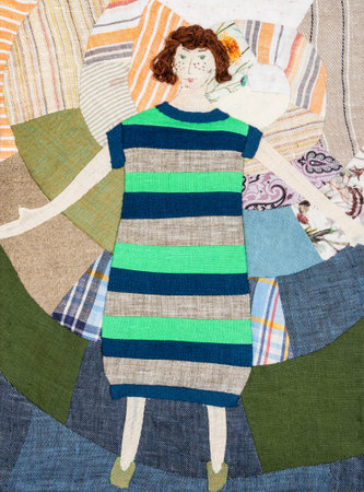 embroidered woman in striped dress on handcrafted patchwork pillowcase