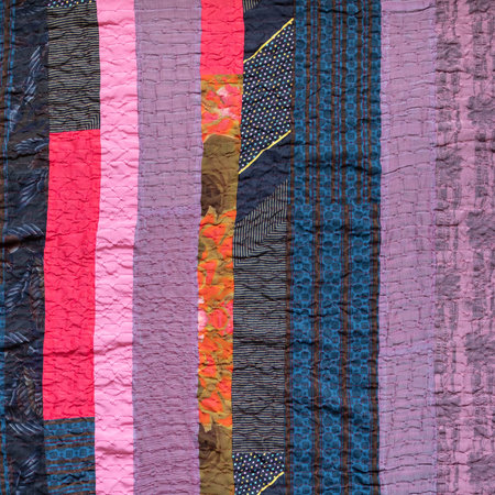 hand-stitched patchwork cloth from various fabric stripes