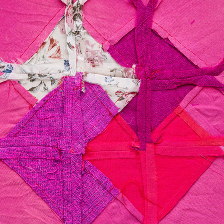 rear side of hand-crafted square piece for pathcwork fabric close up