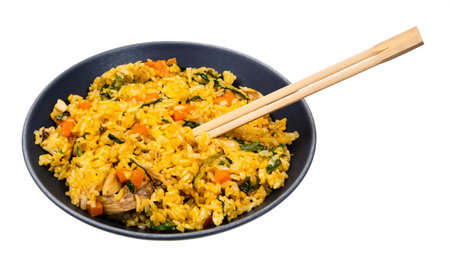 Vietnamese Fried Rice with vegetables and chicken in bowl with chopsticks cutout on white backgroundの写真素材