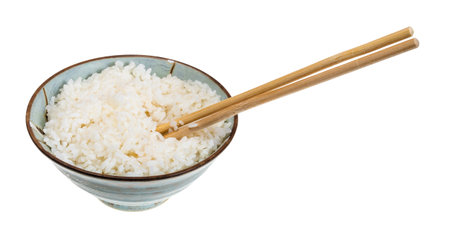 boiled rice in bowl with chopsticks cutout on white backgroundの写真素材