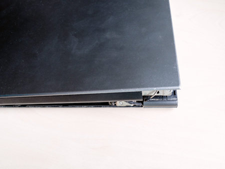 burnt and frayed electrical power wire of matrix of old laptop on the table