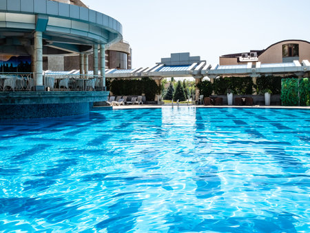 Yerevan, Armenia - August 21, 2023: blue water surface of outdoor pool in Multi Grand Pharaon Hotel in Yerevan - Abovyan city near on sunny summer dayのeditorial素材