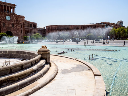 fountains in water pool on Republic Square in Yerevan city on sunny summer day. Republic Square is the central town squareの写真素材