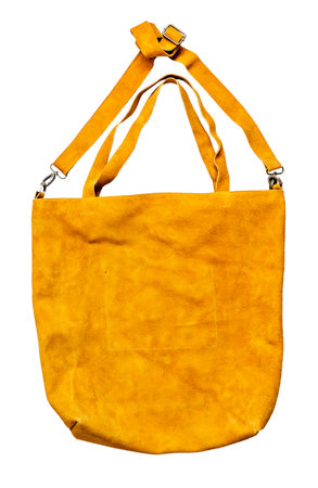 empty handcrafted yellow suede bag cutout on white backgroundの写真素材