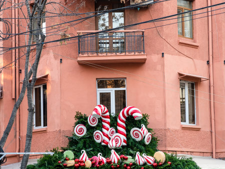 Christmas ornaments on pink wall of apartment building in Yerevan cityの写真素材