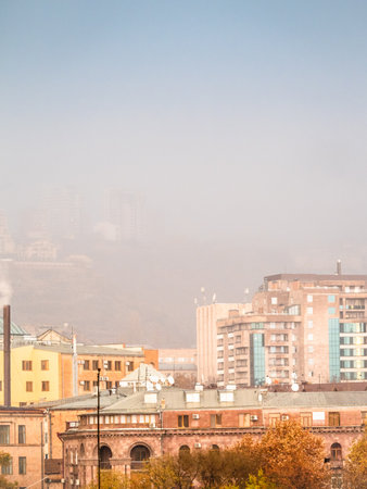 air in rain over city district in rainy autumn day in Yerevan cityの写真素材