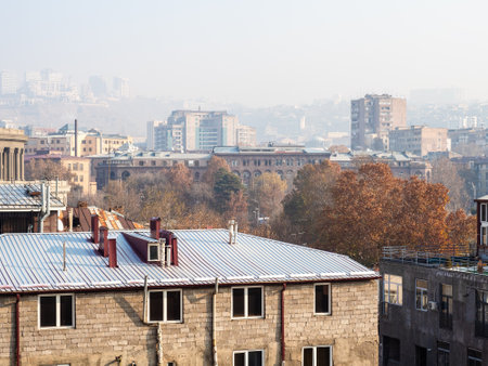 view of Yerevan city in sunny morning with urban smog in winterの写真素材