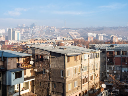 above view of Yerevan city in sunny winter morning with smog in airの写真素材