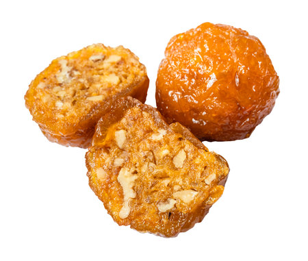 yellow Alani Armenian sweet with nuts, made from dried peaches with addition of honey cut out on white backgroundの写真素材