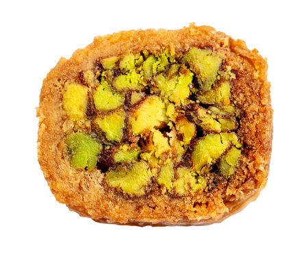 top view of piece of mabrume baklava with pistachio cut out on white backgroundの写真素材