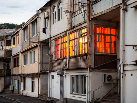 illuminated residential house in Kapan town in spring evening twilight, in Syunik Province of Armeniaの写真素材