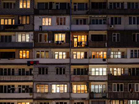 facade of illuminated apartment building in Kapan town in night, in Syunik Province of Armeniaの写真素材