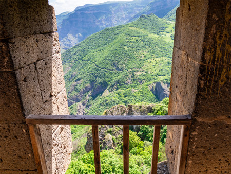 view of green mountains from room of Tatev Monastery in Syunik Province of Armenia on sunny May morningの写真素材