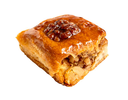 piece of armenian pahlava with walnut cut out on white backgroundの写真素材