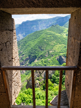 view of green mountains near Tatev Monastery from chamber in Syunik Province of Armenia on sunny May morningの写真素材