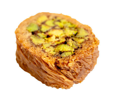 piece of mabrume baklava with pistachio cut out on white backgroundの写真素材