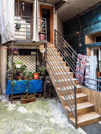 stairs in urban yard in old house in old Batumi city, Georgia on summer dayの写真素材