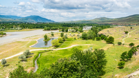 panoramic view of Kura river and remains of medieval settlement from Uplistsikhe Cave Town in Georgia on sunny summer dayの写真素材