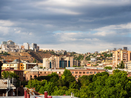 cloudy sky over residential district in Yerevan city, Armenia on sunny summer dayの写真素材