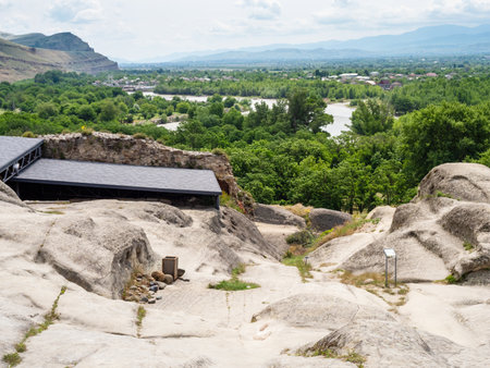 above view of slope of Uplistsikhe Cave Town and Kura river in Georgia on sunny summer dayの写真素材