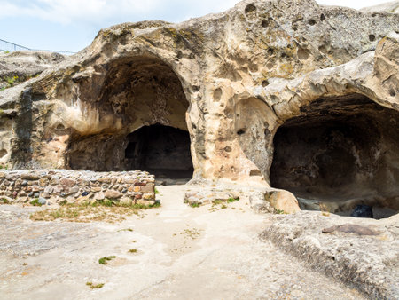 residential caves in Uplistsikhe Cave Town in Georgia on sunny summer dayの写真素材