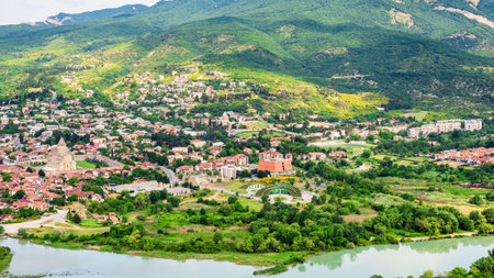 panoramic view of Mtskheta city on Aragvi river bank from Jvari Monastery, Georgia on summer morningの写真素材