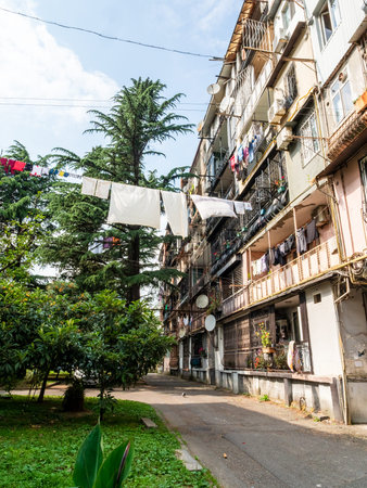 outdoor drying laundry and residential building in Batumi city on summer day, Georgiaの写真素材