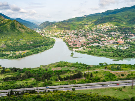 aerial view of road and Kura, Aragvi rivers confluence near Mtskheta city from Jvari Monastery,...