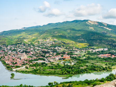 above view of Mtskheta city on Kura and Aragvi river banks from Jvari Monastery, Georgia on summer morningの写真素材