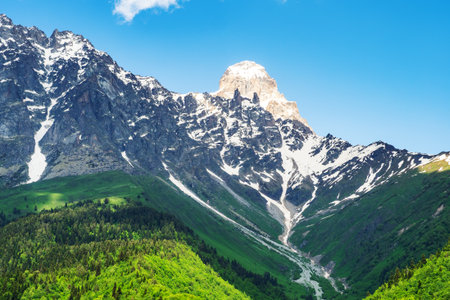 snow-cupped mountain peaks around Maseri village in Samegrelo-Zemo Svaneti province of Georgia on sunny summer dayの写真素材
