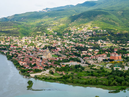 above view of Mtskheta city on confluence of Kura and Aragvi rivers from Jvari Monastery, Georgia on summer morningの写真素材
