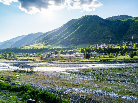 view of Mulkhra riverbed in Mestia town in mountain valley in Samegrelo-Zemo Svaneti province of Georgia on sunny summer dayの写真素材