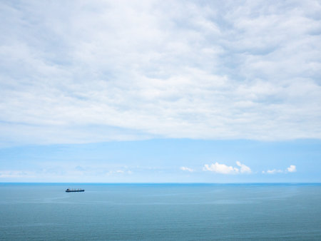 view of blue cloudy sky over Black Sea from Batumi Botanical Garden, Georgia on overcast summer dayの写真素材