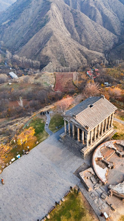 vertical view of Garni Temple in Azat Gorge in Kotayk region of Armenia on sunny autumn eveningの写真素材