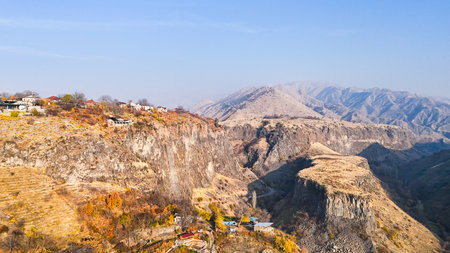 aerial view of Garni village in Azat Gorge in Kotayk region of Armenia on sunny autumn eveningの写真素材