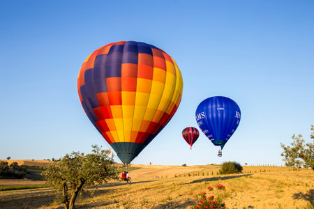 GUALDO CATTANEO, ITALY - JULY 31, 2016: Sagrantino International Challenge Cup. Colorful hot air balloons flying in the skyのeditorial素材