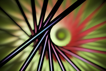 Abstract fantasy figures on blurred background. Computer-generated fractal in green, red, pink, beige, black and blue colors.の写真素材