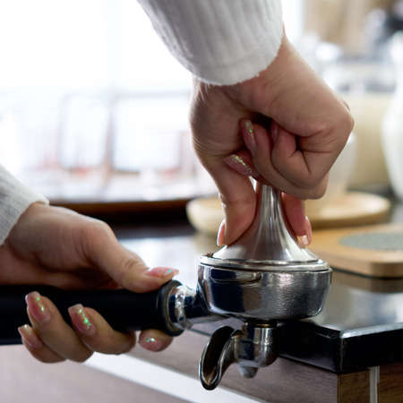Barista making fresh espresso coffee. Espresso Machine Portafilters (Closeup).の写真素材