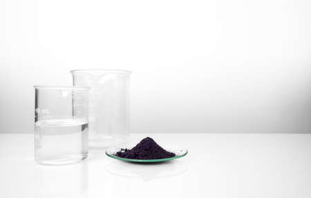 Cosmetic chemicals ingredient on white laboratory table. Potassium Permanganate, Alcohol.の写真素材