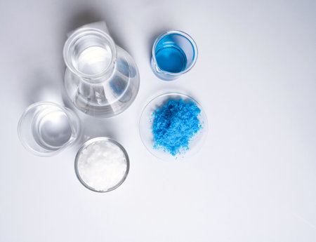 Inorganic chemical on white laboratory table. Copper(II) sulfate, Microcrystalline wax, alcohol. Chemical ingredient for Cosmetics and Toiletries product. Top Viewの写真素材