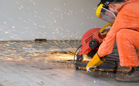 Industrial worker cutting the steel to the size that the customer wants. For the real estate project...