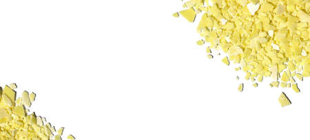 Closeup chemical ingredient on white laboratory table (Top View). Sodium sulfide flakes, a yellow appearance owing to the presence of polysulfides.の写真素材