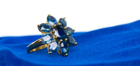 Blue Sapphire Jewel or gems ring on velvet bag. Collection of natural gemstones accessories. Studio...